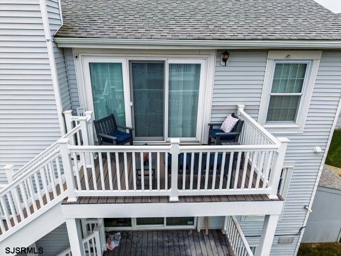 167 South 40th, Unit 2 Brigantine, NJ 08203 - Photo 23 of 28 a view of a chair and table in the balcony