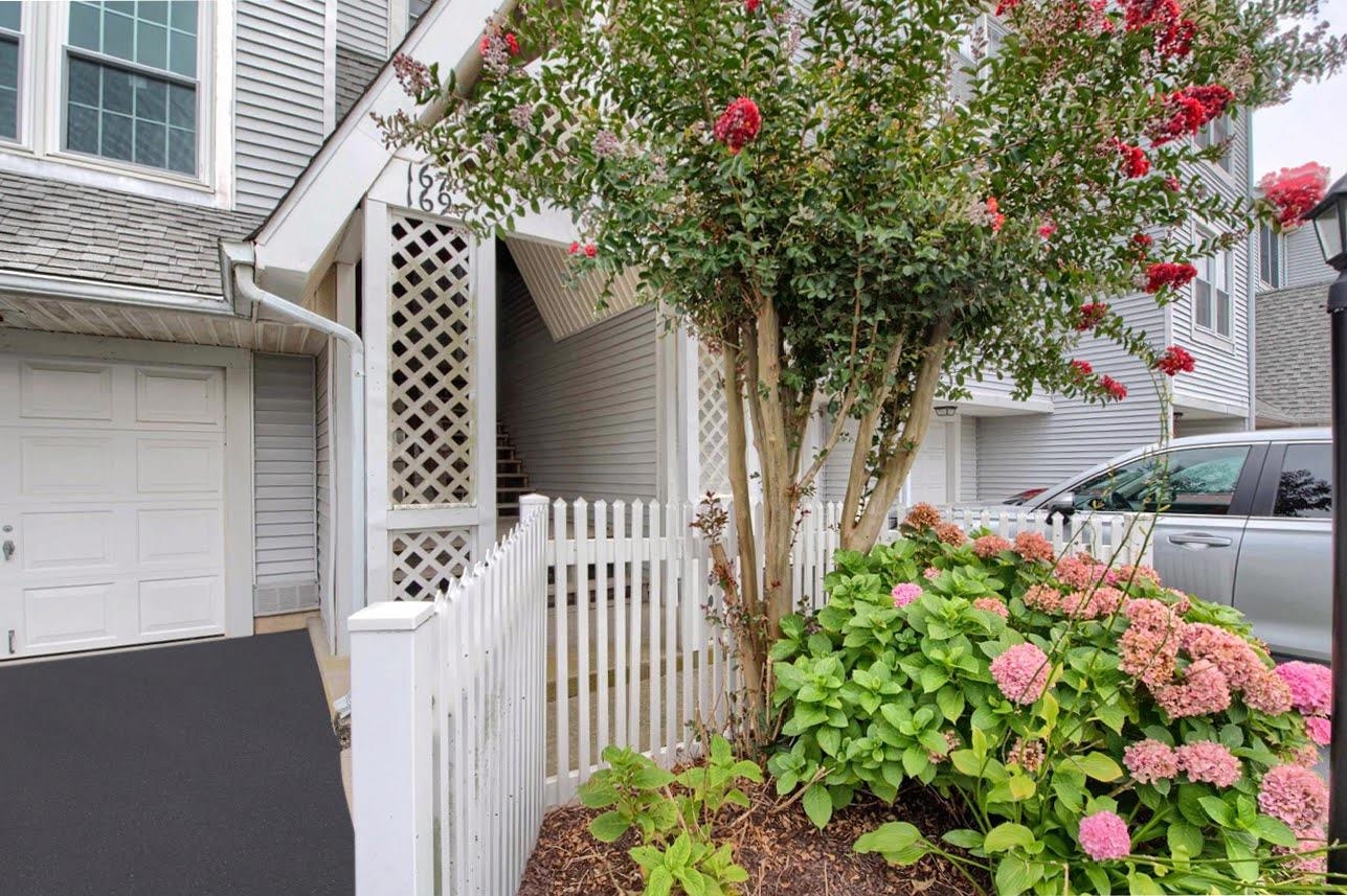 167 South 40th, Unit 2 Brigantine, NJ 08203 - Photo 3 of 28 a flower plants in front of a house