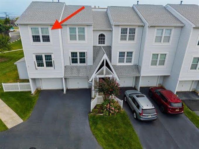 167 South 40th, Unit 2 Brigantine, NJ 08203 - Photo 4 of 28 a front view of a house with a garden and parking space