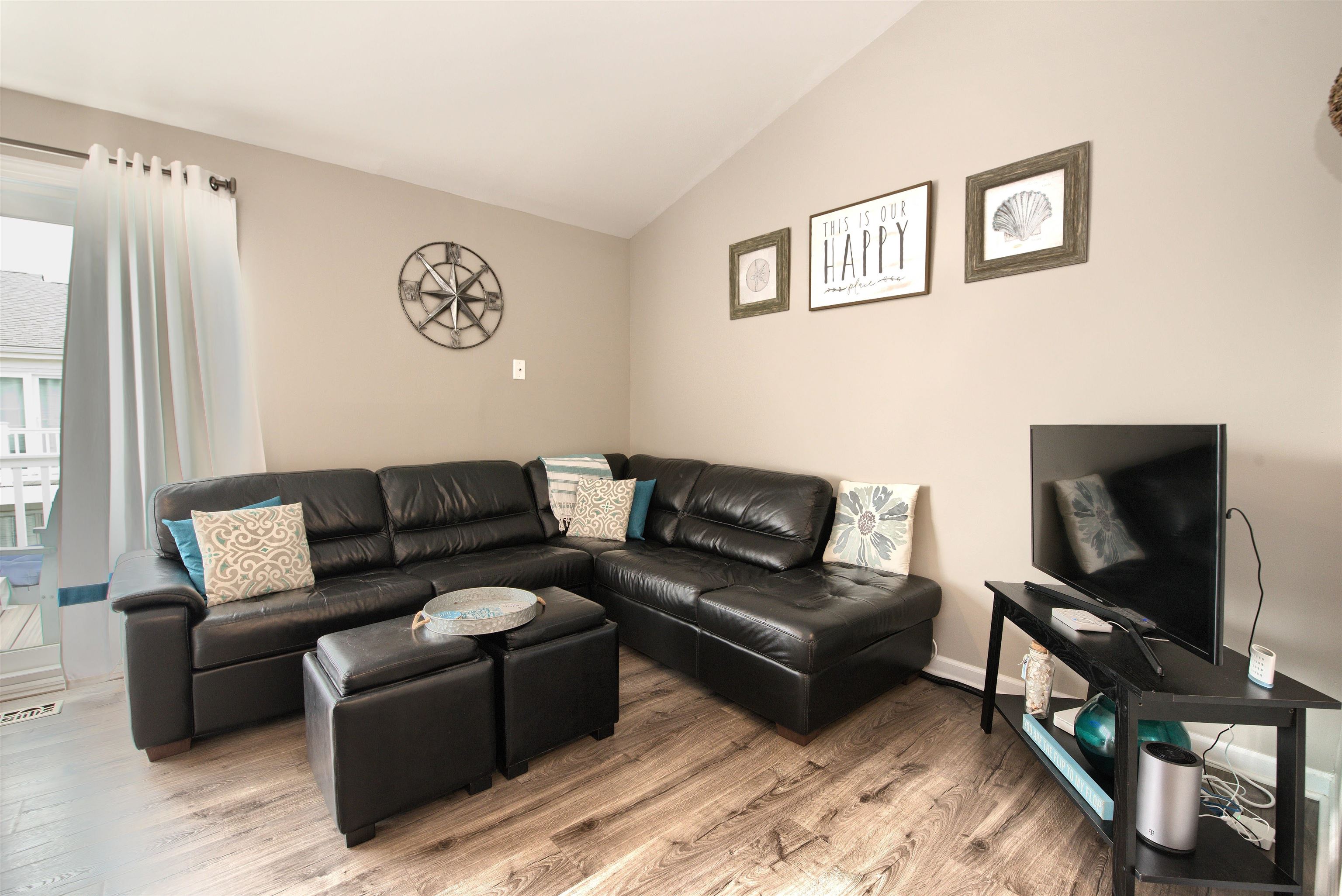 167 South 40th, Unit 2 Brigantine, NJ 08203 - Photo 6 of 28 a living room with furniture and a flat screen tv