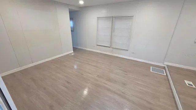 a view of a kitchen with a sink cabinets and a window