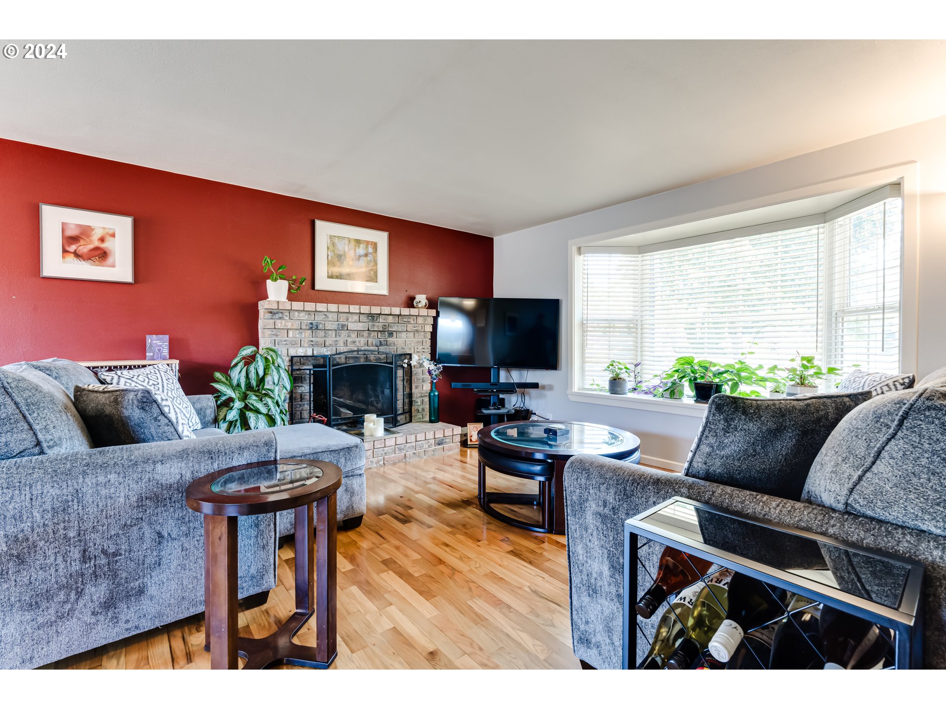 3715 Harlow Road Eugene, OR 97401 - Photo 11 of 39 a living room with furniture a flat screen tv and a fireplace