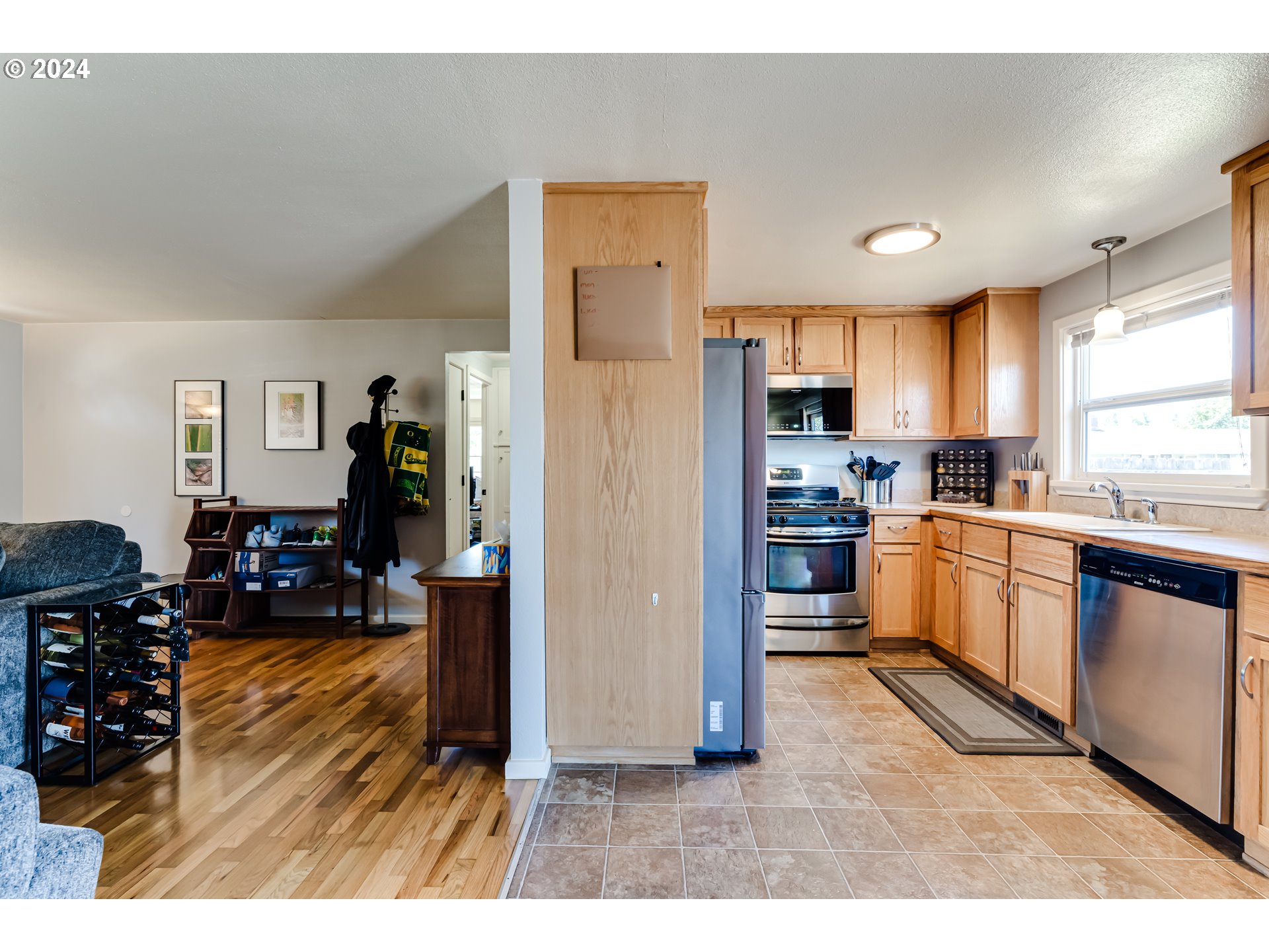 3715 Harlow Road Eugene, OR 97401 - Photo 14 of 39 a kitchen with refrigerator cabinets and furniture