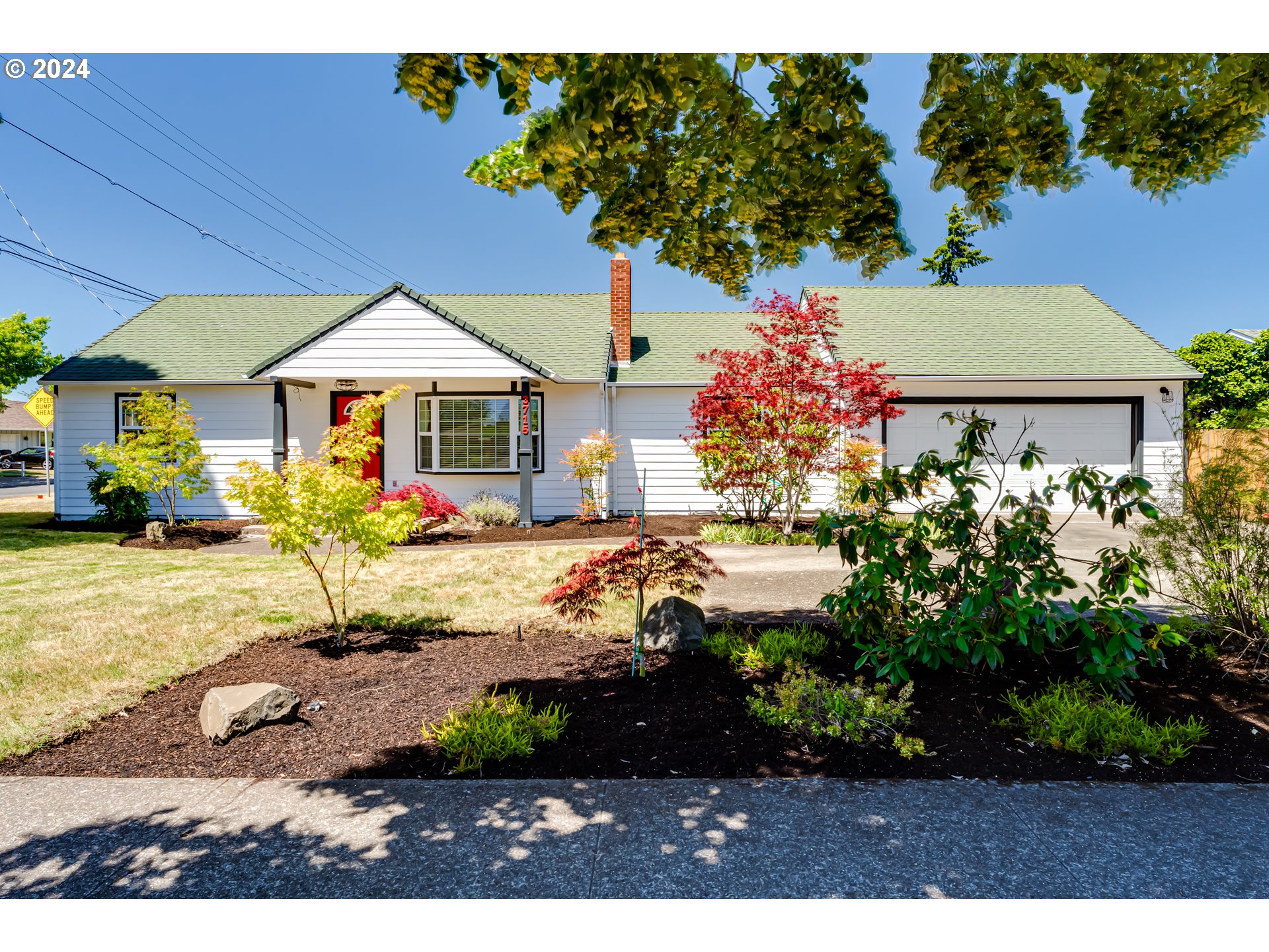 3715 Harlow Road Eugene, OR 97401 - Photo 2 of 39 a front view of a house with garden