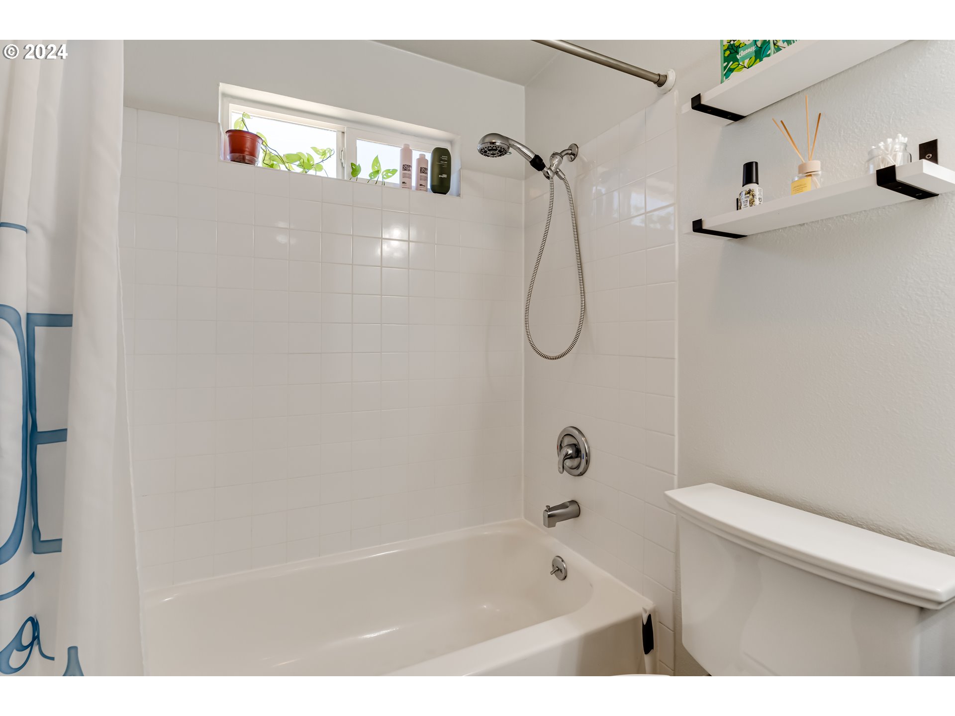 3715 Harlow Road Eugene, OR 97401 - Photo 30 of 39 a bathroom with a shower and a toilet