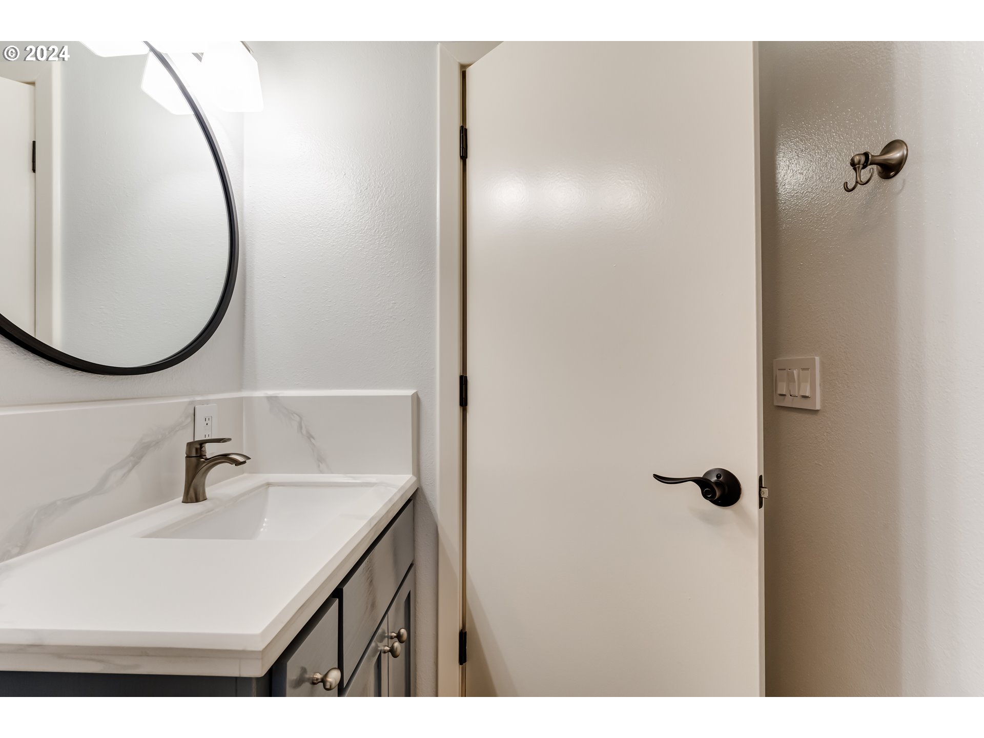 3715 Harlow Road Eugene, OR 97401 - Photo 31 of 39 a bathroom with a sink vanity and a mirror