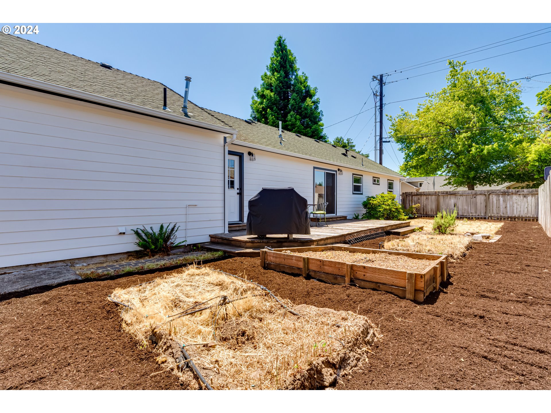 3715 Harlow Road Eugene, OR 97401 - Photo 37 of 39 a view of a backyard with a patio and a garden