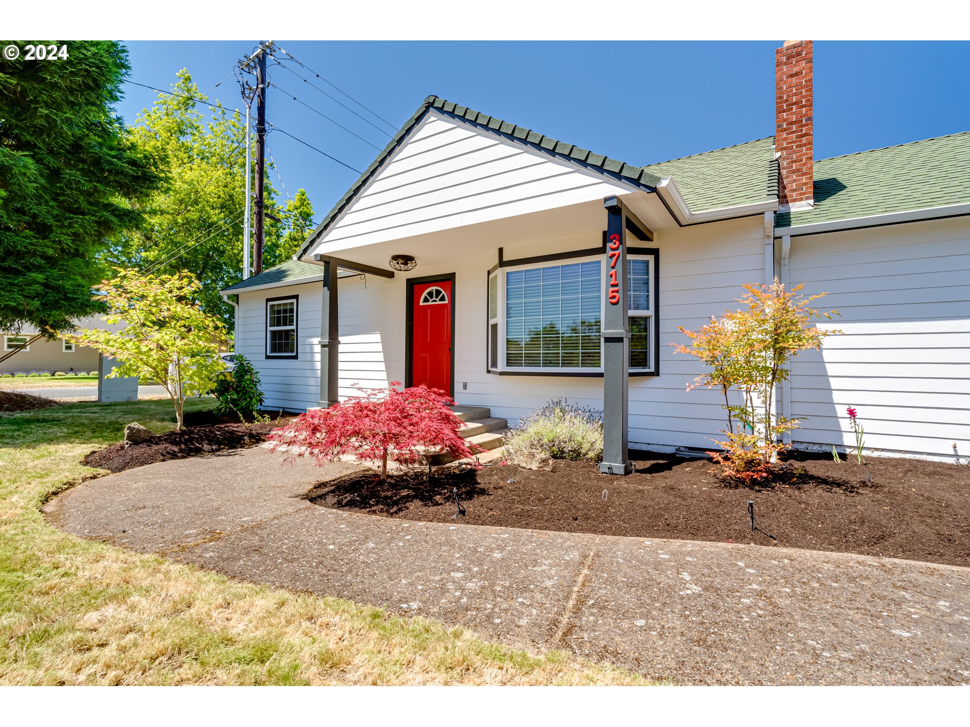 3715 Harlow Road Eugene, OR 97401 - Photo 5 of 39 a front view of a house with garden