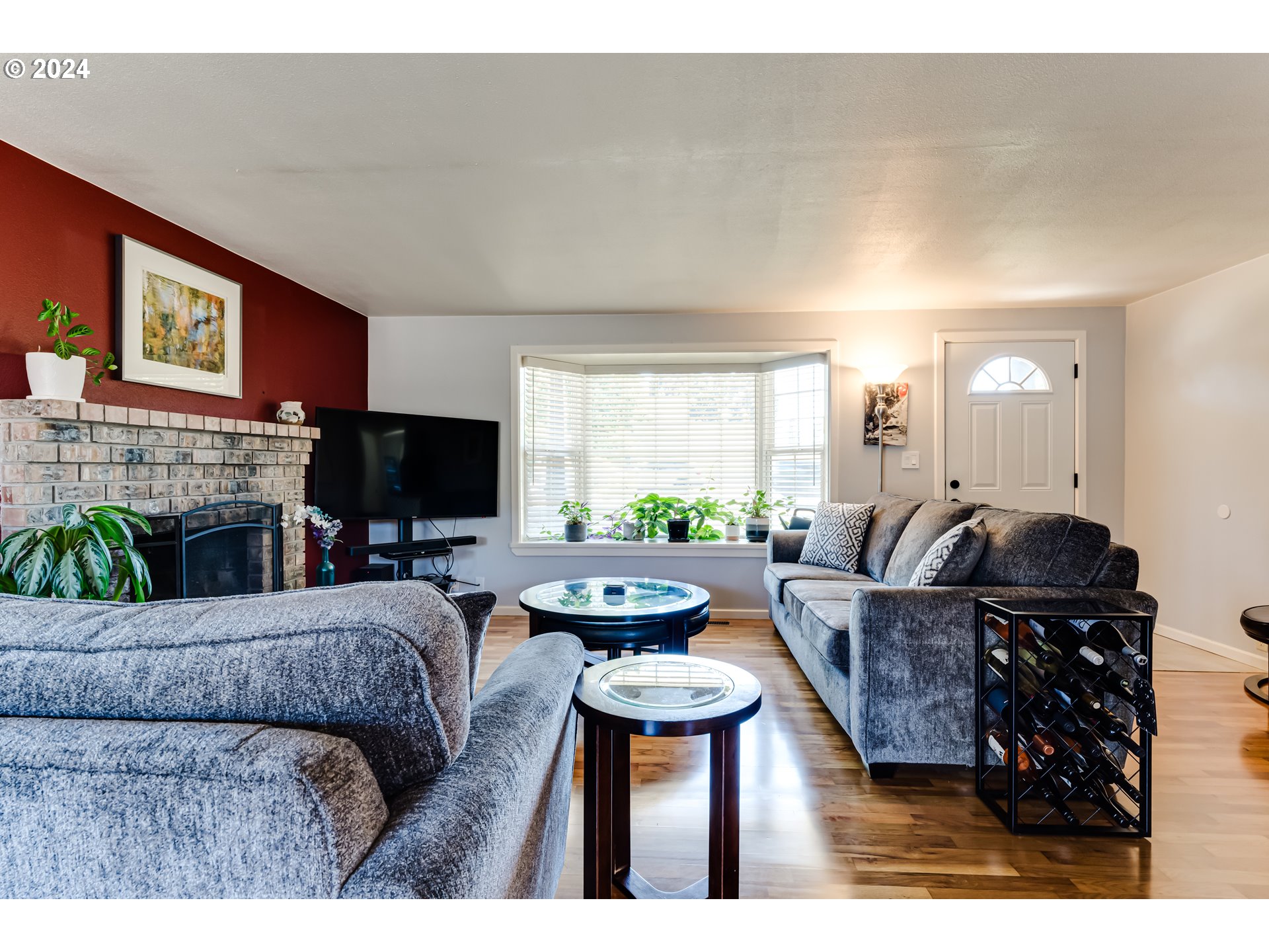 3715 Harlow Road Eugene, OR 97401 - Photo 10 of 39 a living room with furniture a fireplace and a flat screen tv
