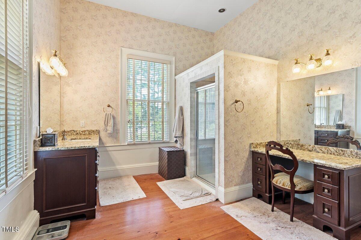 206 Shaver Road Macon, NC 27551 - Photo 39 of 68 a living room with furniture a large window and a table