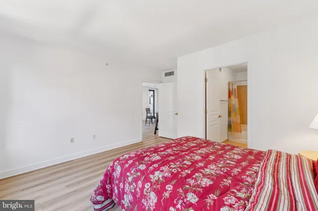 a bedroom with a bed and a table