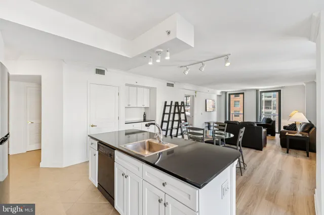 a view of a livingroom with furniture window and wooden floor