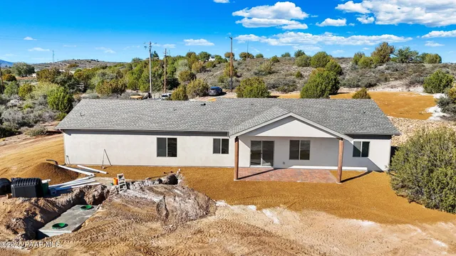 a house with a tree in the background