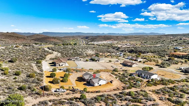 an aerial view of residential building with trees