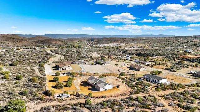 an aerial view of residential building with trees