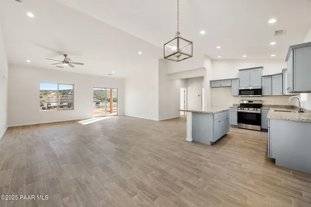 a view of kitchen with sink microwave and stove