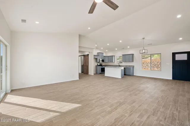 a view of kitchen and refrigerator