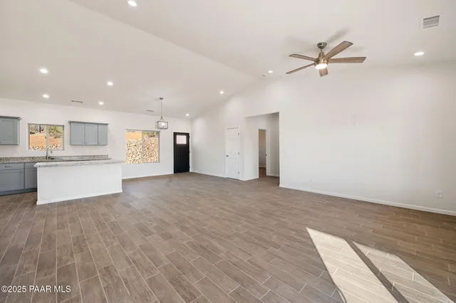 a view of a kitchen with a sink and a window
