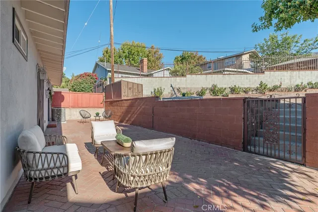 a view of a balcony with furniture