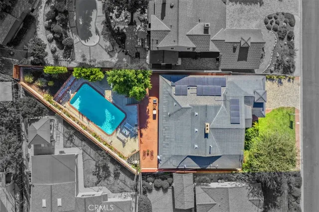 an aerial view of multiple houses with outdoor space