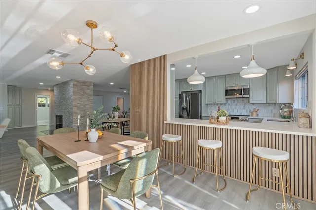 an open kitchen with a table and chairs