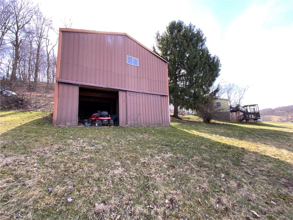 229 Upper Service Road Hookstown, PA 15050 - Photo 17 of 21 a view of a small house with a yard