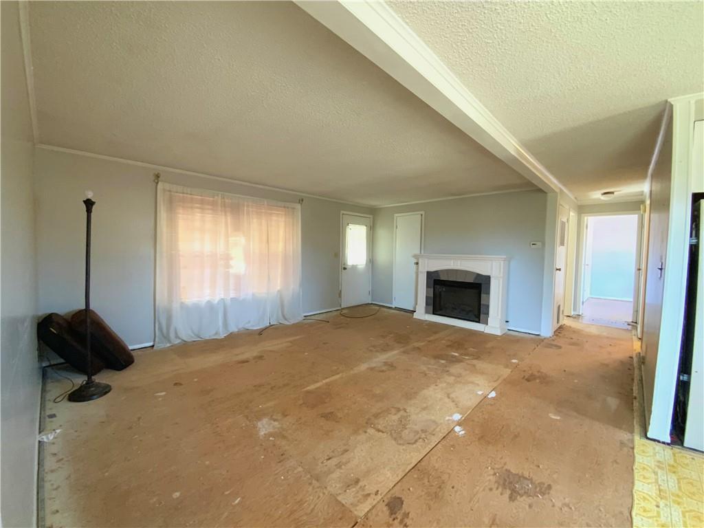 229 Upper Service Road Hookstown, PA 15050 - Photo 4 of 21 a bedroom with a bed and a fireplace