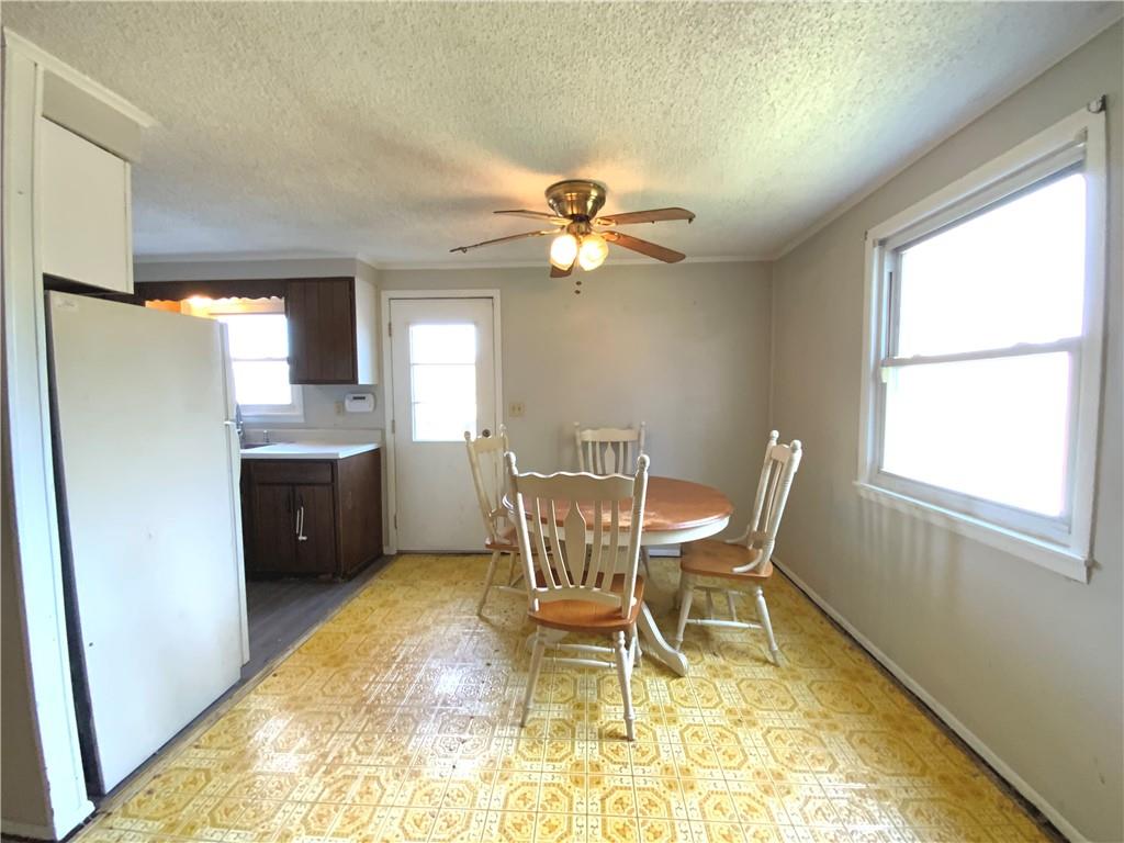 229 Upper Service Road Hookstown, PA 15050 - Photo 5 of 21 a view of a dining room with furniture and a chandelier