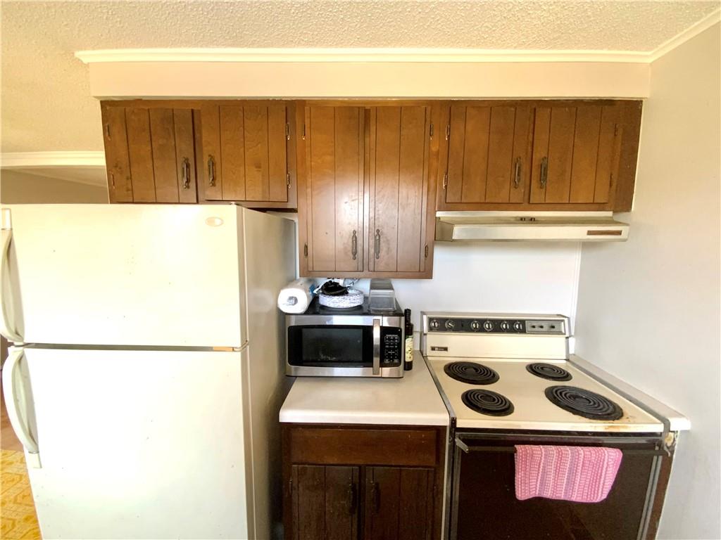 229 Upper Service Road Hookstown, PA 15050 - Photo 7 of 21 a kitchen with a stove and a refrigerator