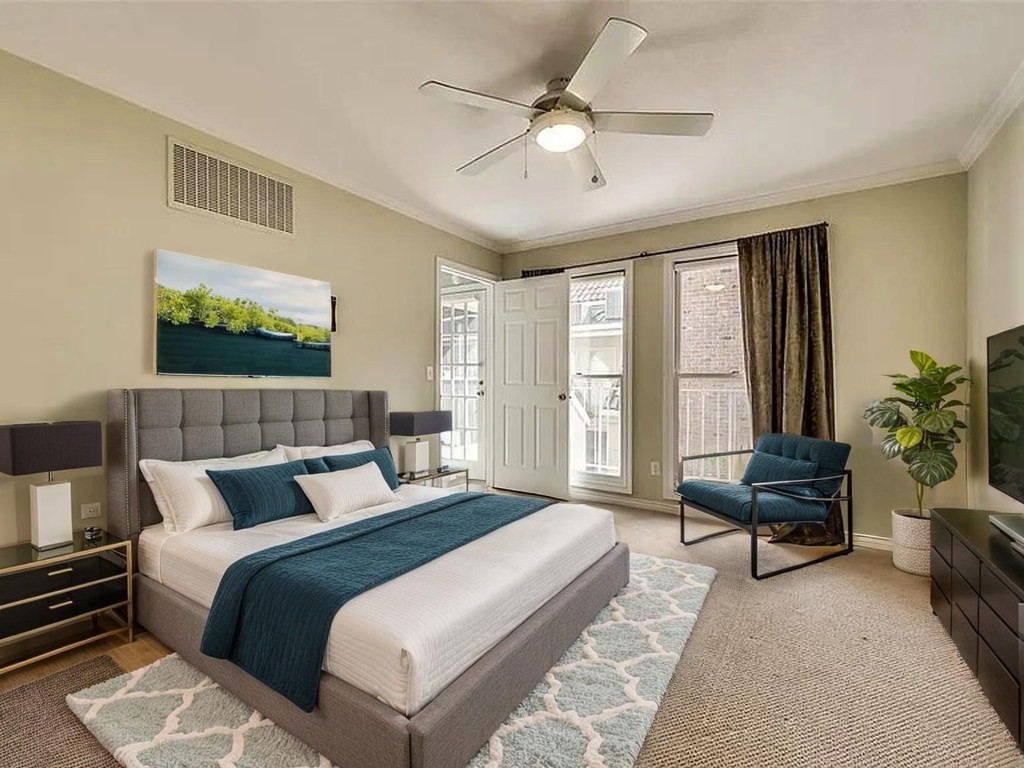 4518 Glenwick Lane Dallas, TX 75205 - Photo 6 of 14 a bedroom with a bed and a couch