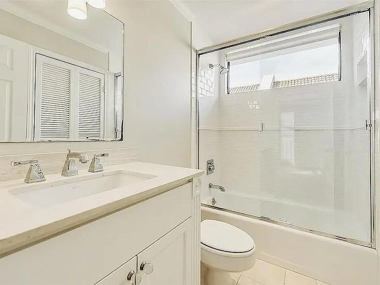 4518 Glenwick Lane Dallas, TX 75205 - Photo 10 of 14 a bathroom with a granite countertop sink toilet and shower