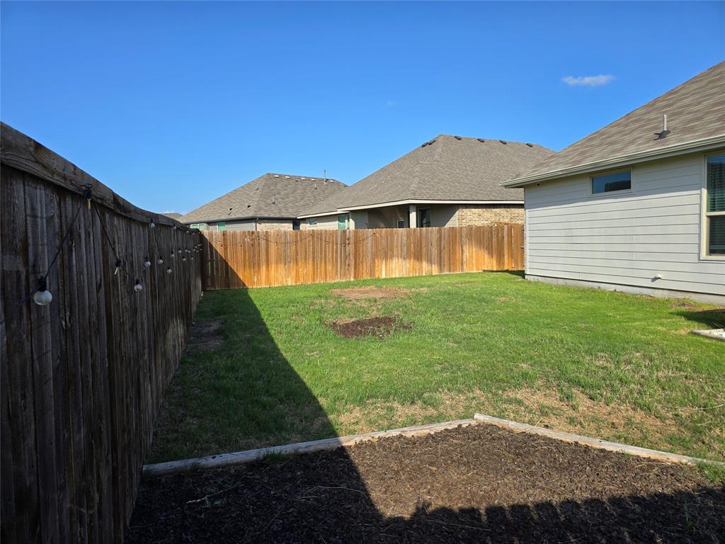 508 Williams Way Van Alstyne, TX 75495 - Photo 25 of 26 a view of backyard with a garden and plants