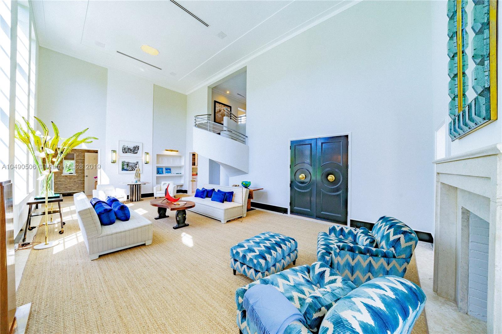 6332 Alton Road Miami Beach, FL 33141 - Photo 11 of 91 a living room with furniture and a potted plant