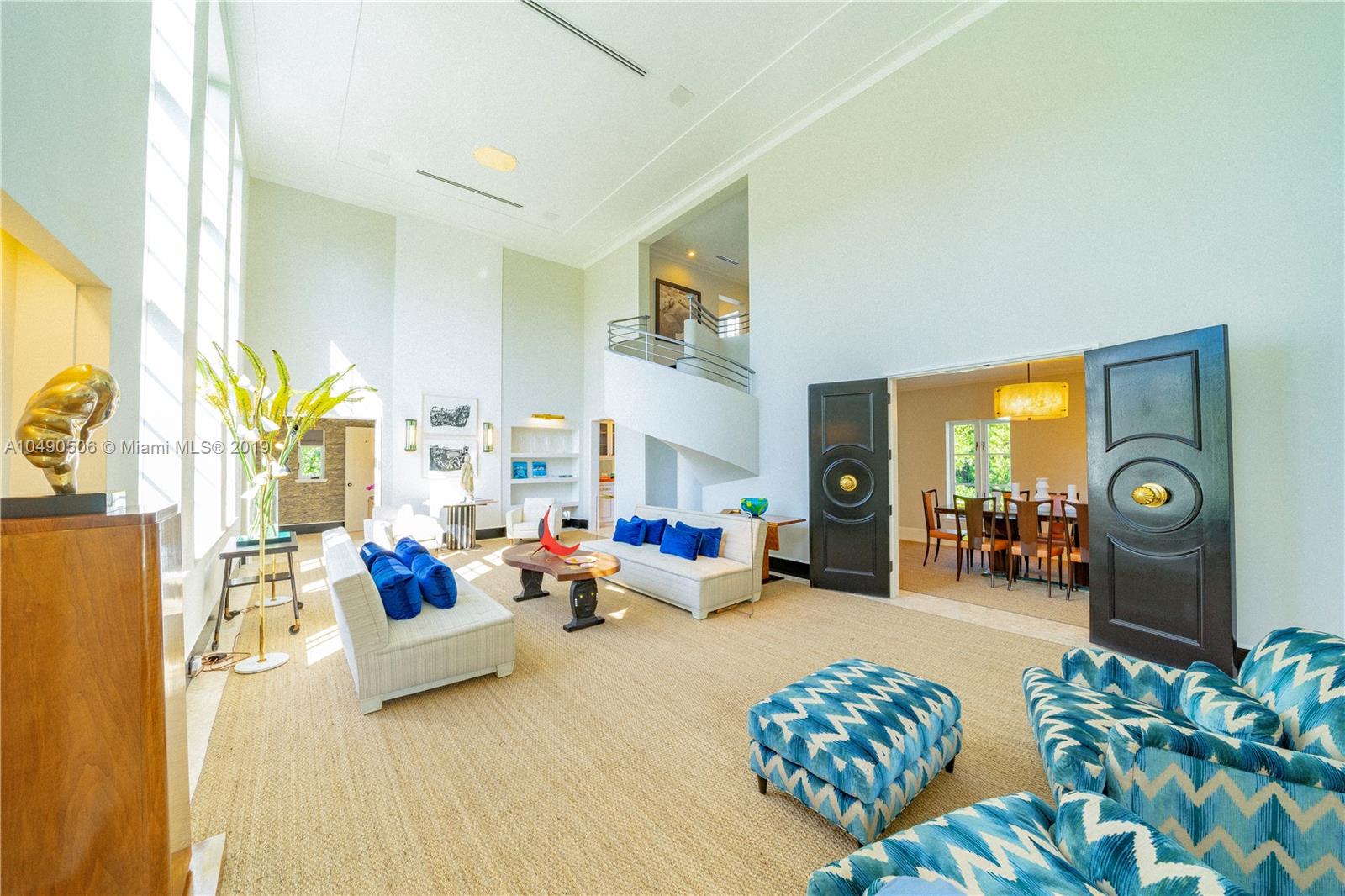 6332 Alton Road Miami Beach, FL 33141 - Photo 12 of 91 a living room with furniture and a lamp