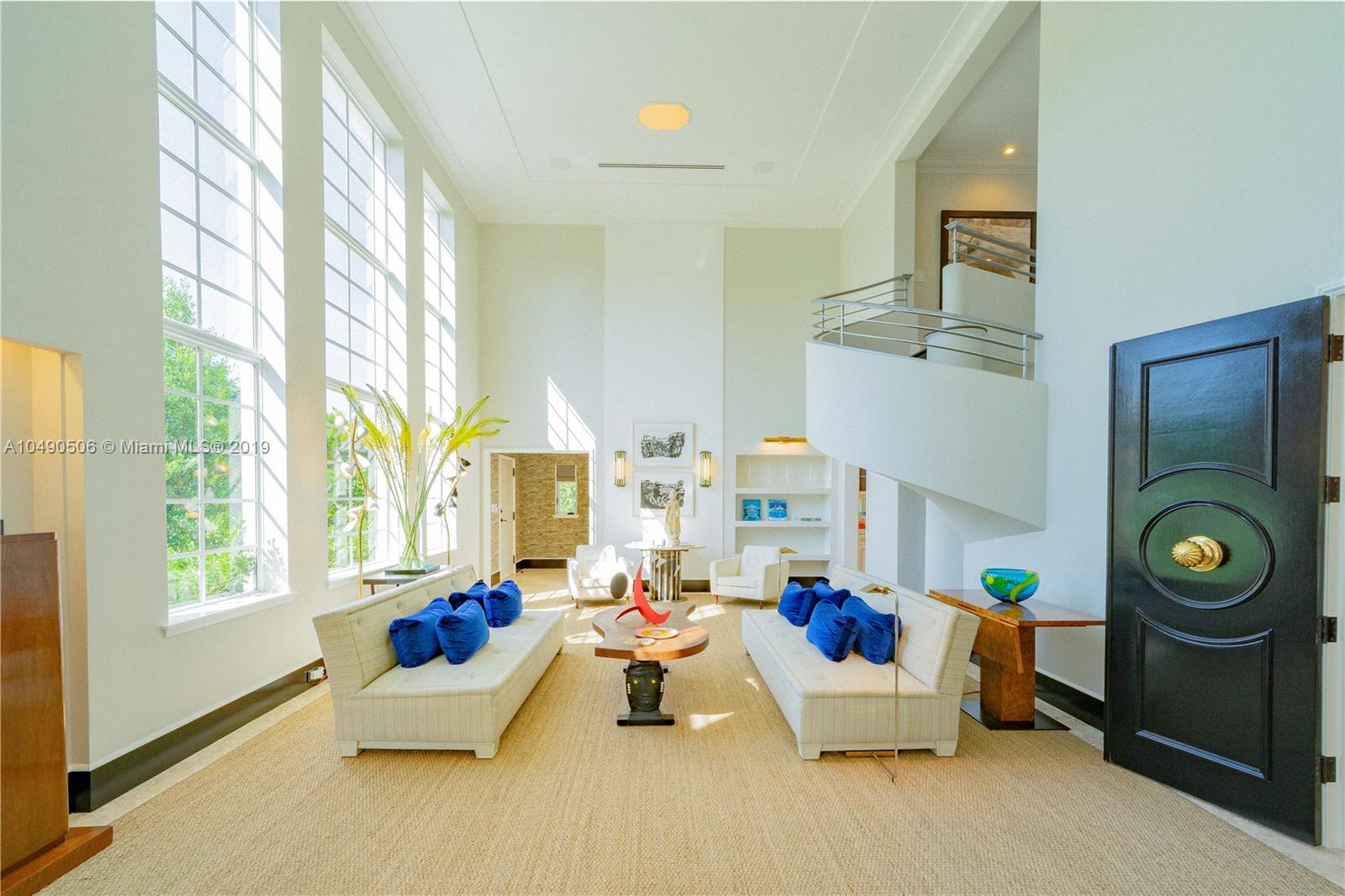 6332 Alton Road Miami Beach, FL 33141 - Photo 2 of 91 a living room with furniture and a window