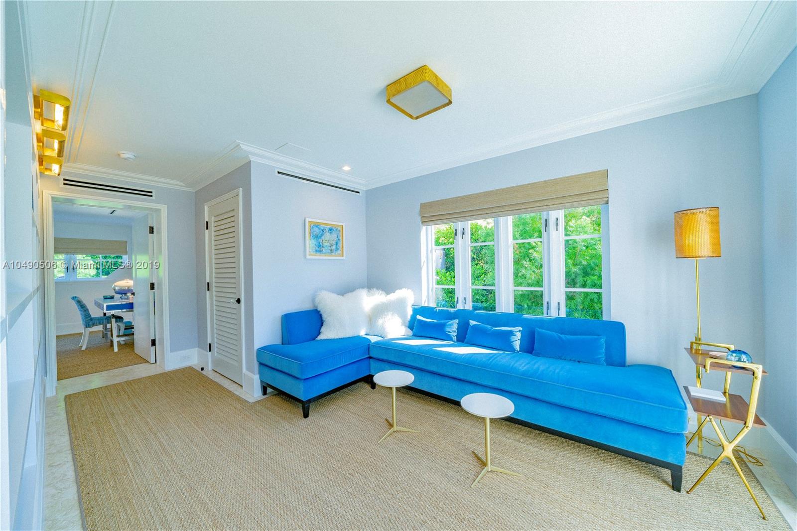 6332 Alton Road Miami Beach, FL 33141 - Photo 21 of 91 a living room with furniture and a window