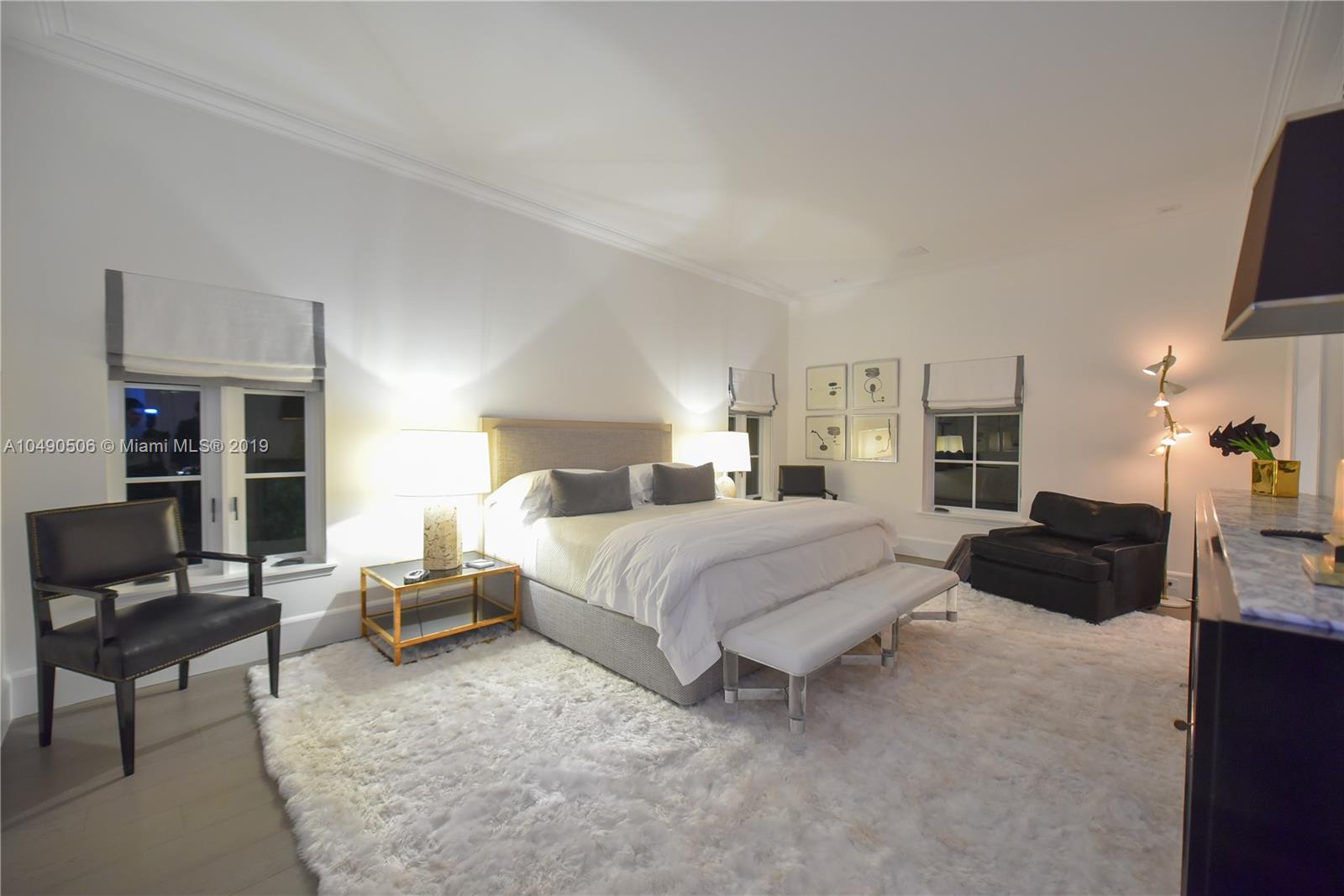 6332 Alton Road Miami Beach, FL 33141 - Photo 25 of 91 a bedroom with a bed a couch and dresser