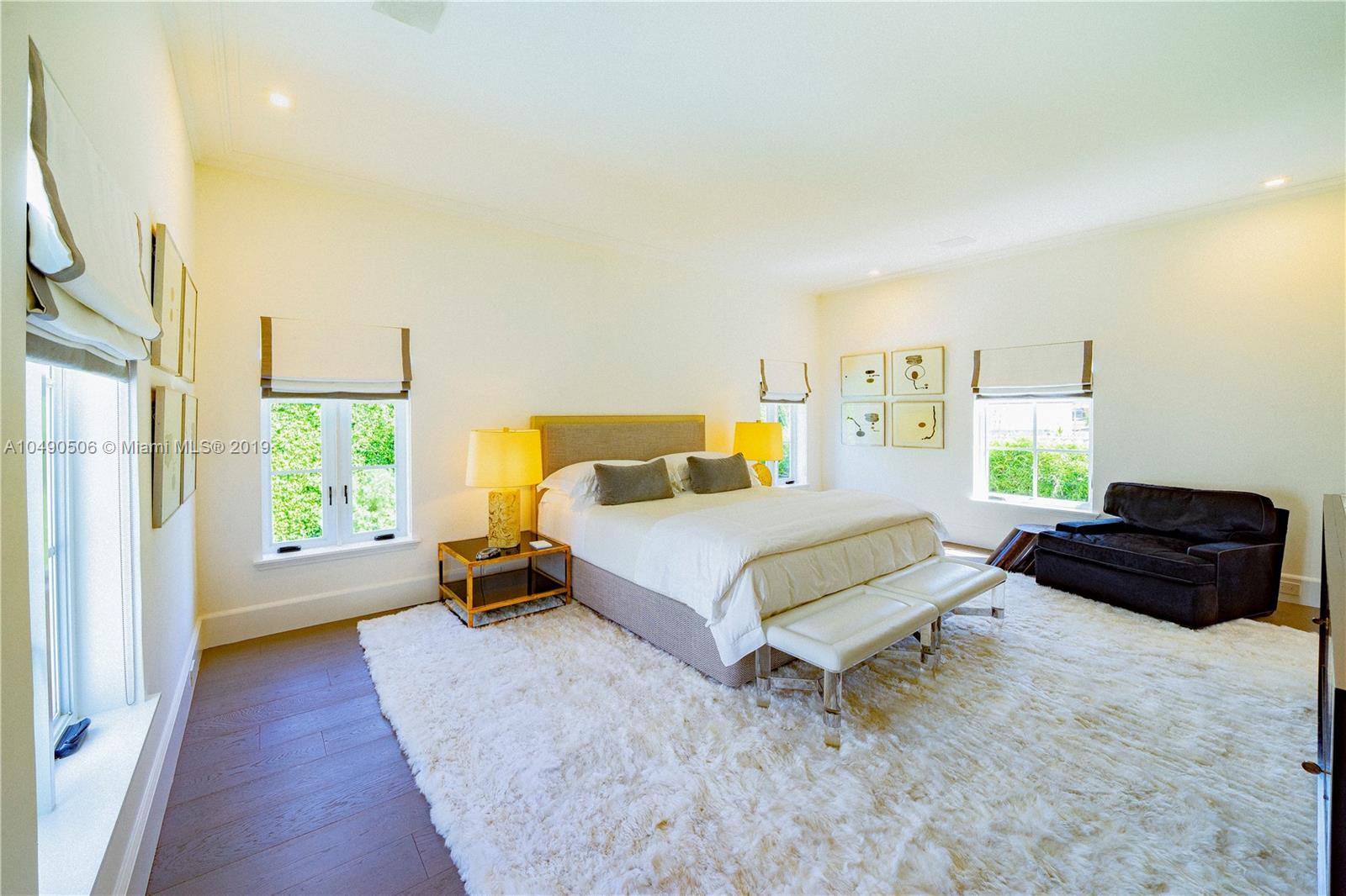 6332 Alton Road Miami Beach, FL 33141 - Photo 27 of 91 a bedroom with a bed a couch and a window