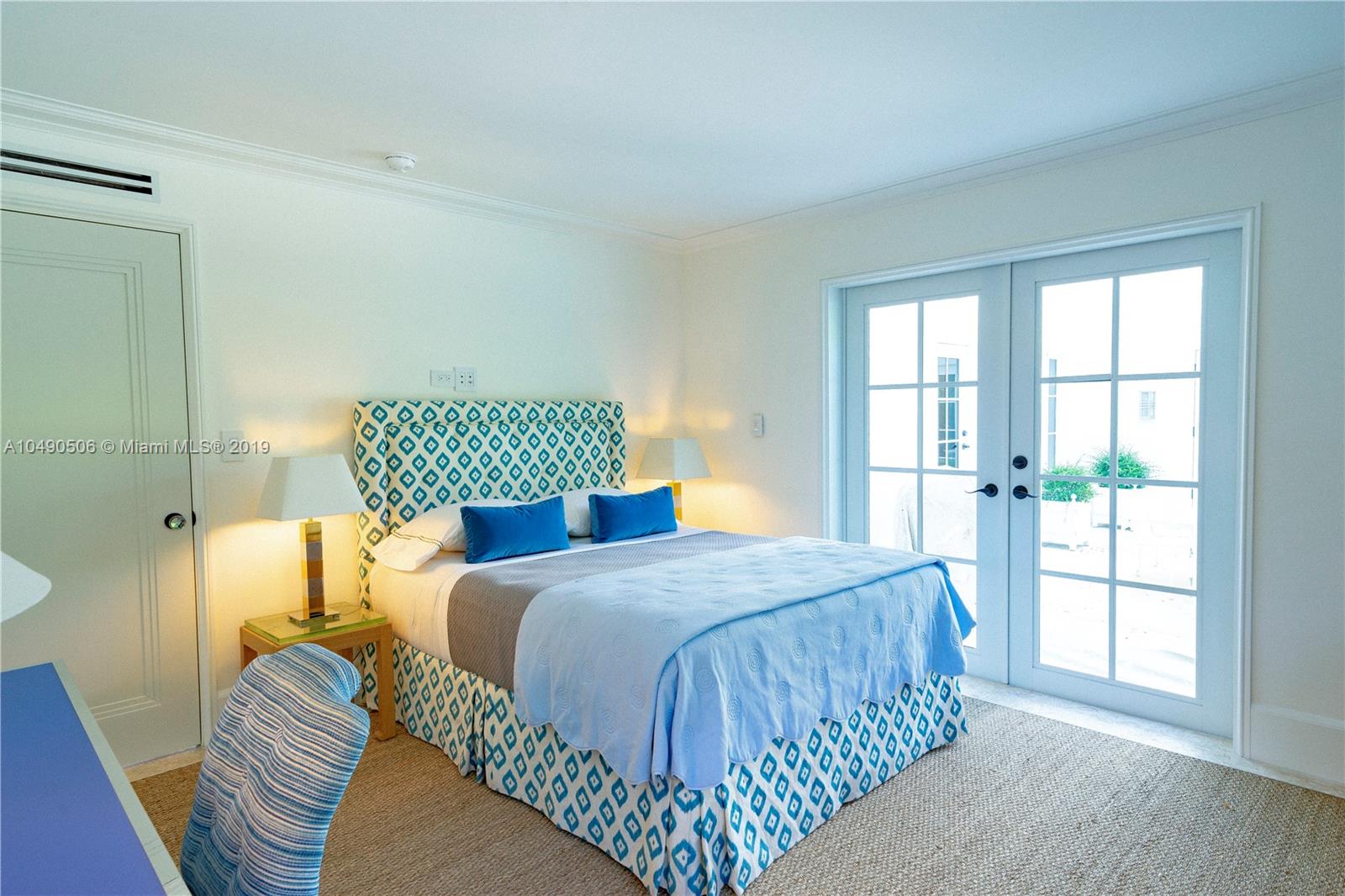 6332 Alton Road Miami Beach, FL 33141 - Photo 44 of 91 a bedroom with a bed and window