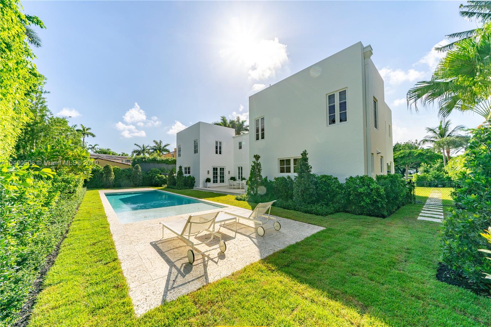 6332 Alton Road Miami Beach, FL 33141 - Photo 46 of 91 a view of a house with swimming pool and sitting area