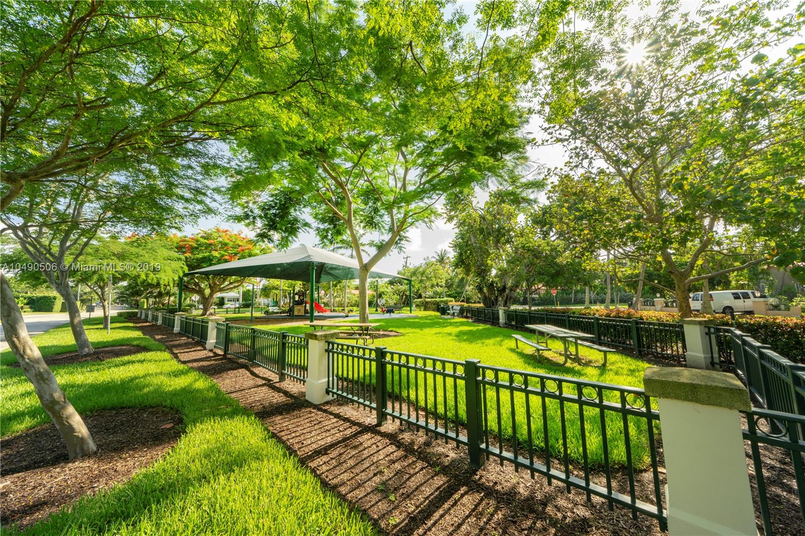 6332 Alton Road Miami Beach, FL 33141 - Photo 58 of 91 a view of a swimming pool and deck in the backyard