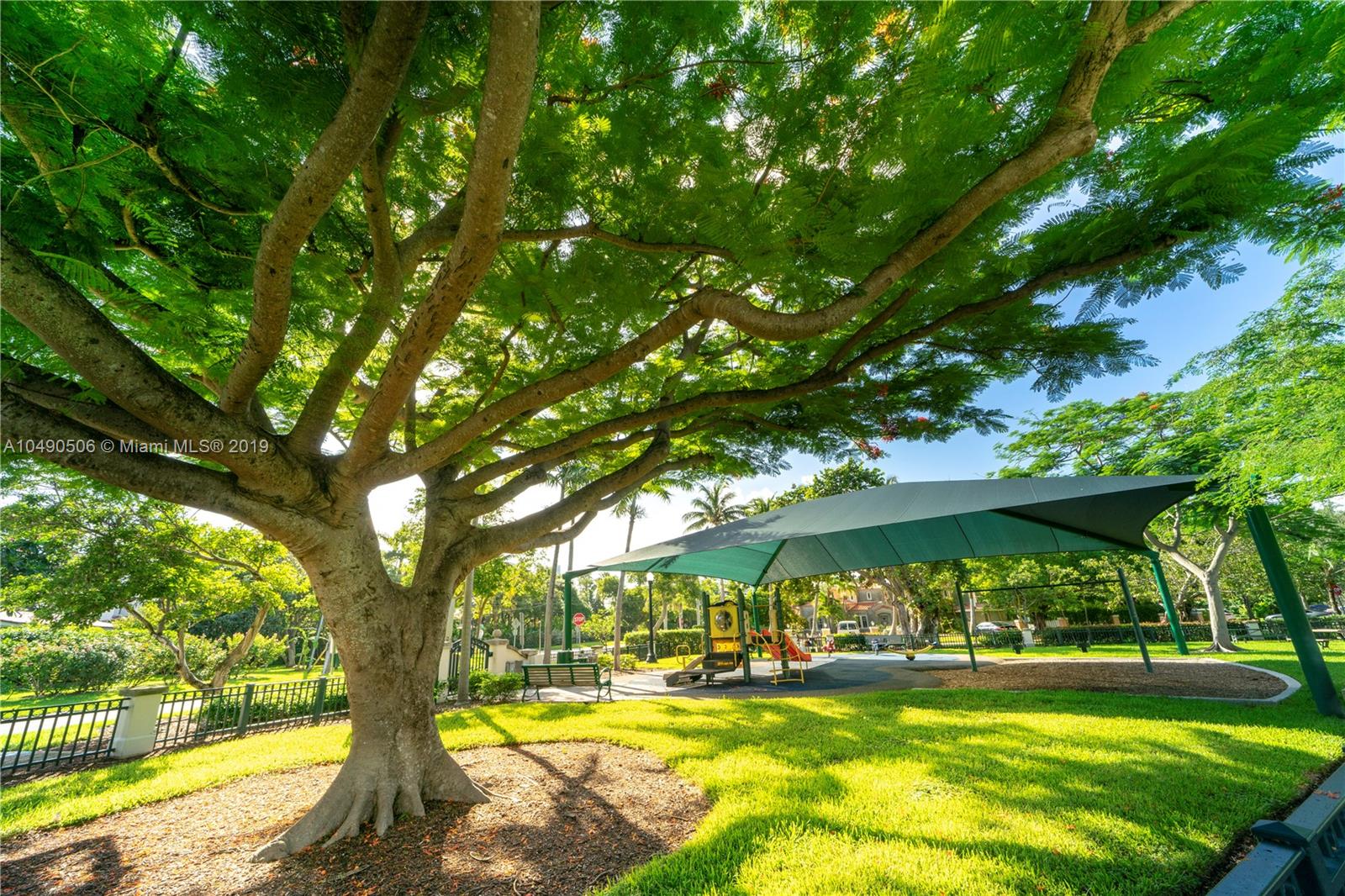 6332 Alton Road Miami Beach, FL 33141 - Photo 60 of 91 a view of swimming pool with an outdoor space and seating area