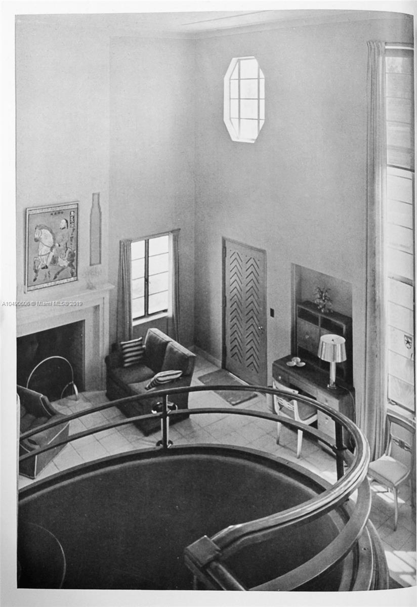 6332 Alton Road Miami Beach, FL 33141 - Photo 63 of 91 a living room with furniture and a fireplace