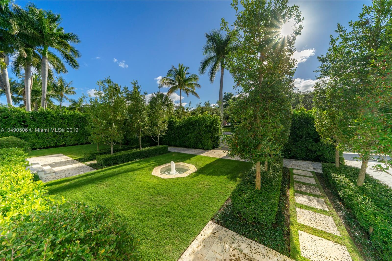 6332 Alton Road Miami Beach, FL 33141 - Photo 82 of 91 a view of a swimming pool with a yard
