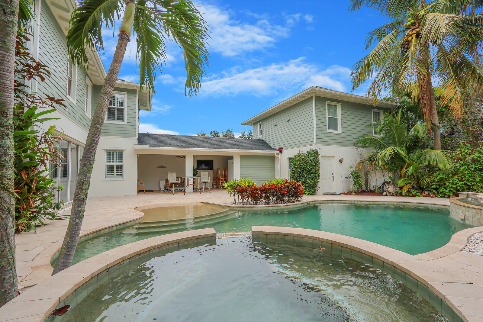 101 St Pierre Way Jupiter, FL 33458 - Photo 50 of 57 a front view of a house with garden