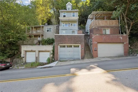 front view of a house with a street