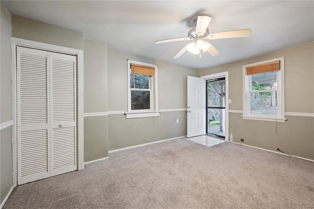 677 Greentree Road Pittsburgh, PA 15220 - Photo 20 of 29 an empty room with windows and fan