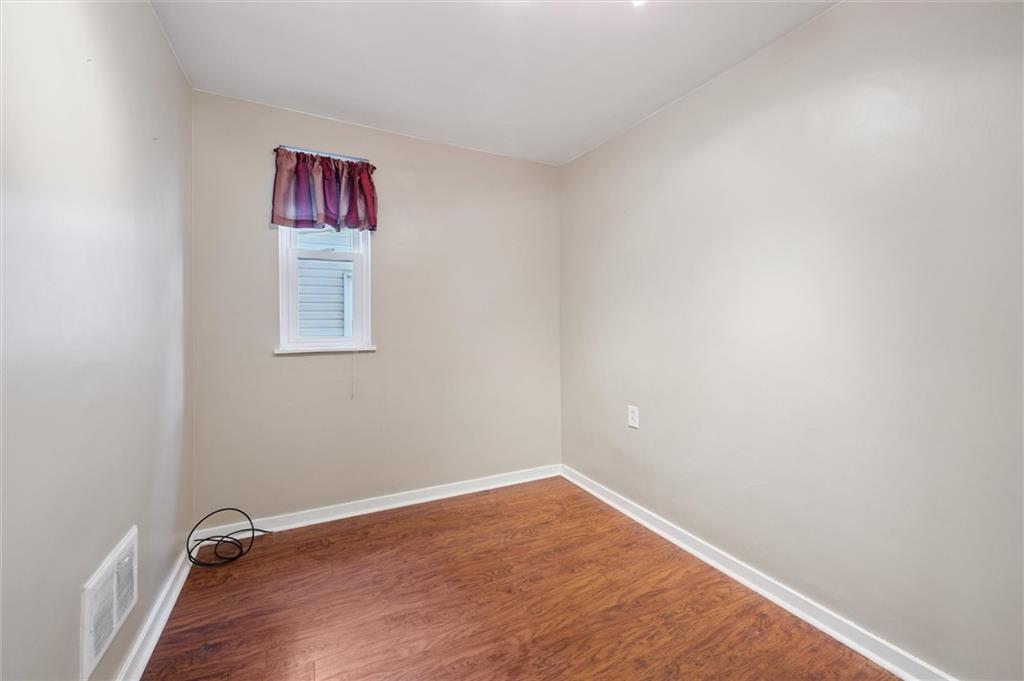 677 Greentree Road Pittsburgh, PA 15220 - Photo 21 of 29 a view of a room with wooden floor and a window