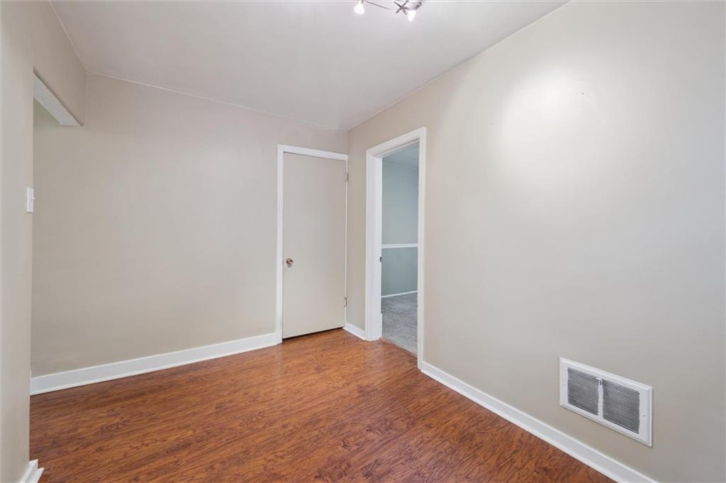 677 Greentree Road Pittsburgh, PA 15220 - Photo 22 of 29 a view of empty room with wooden floor
