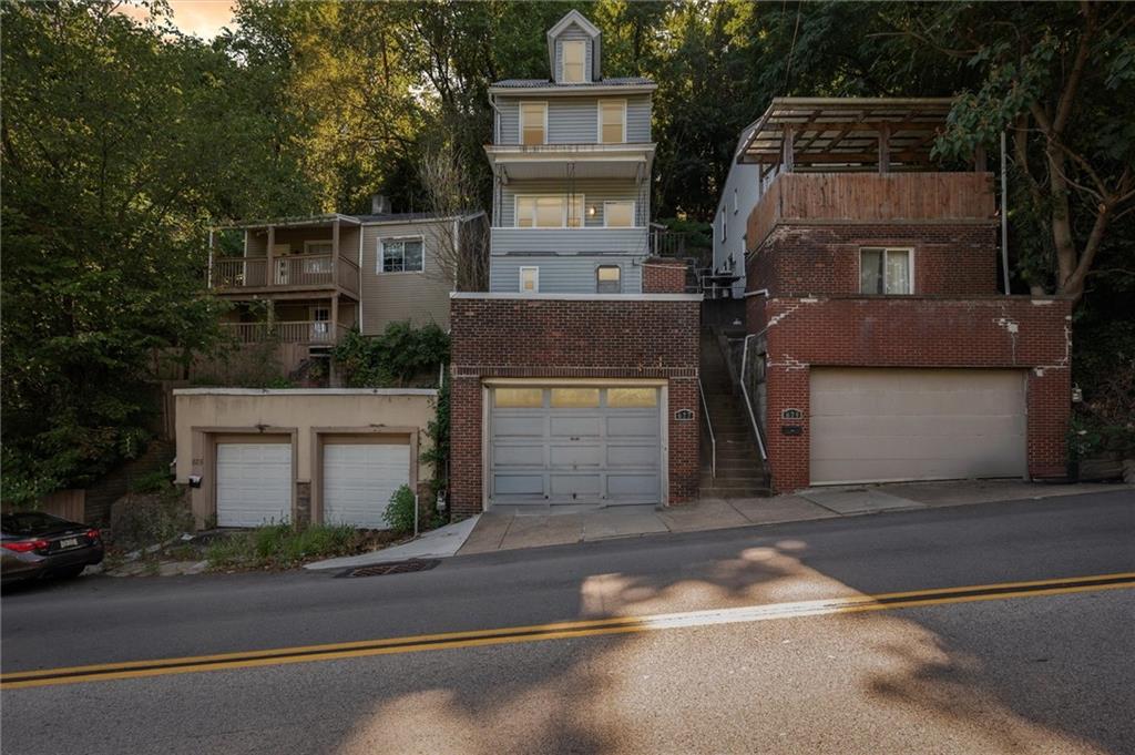 677 Greentree Road Pittsburgh, PA 15220 - Photo 29 of 29 a front view of a house with a garage